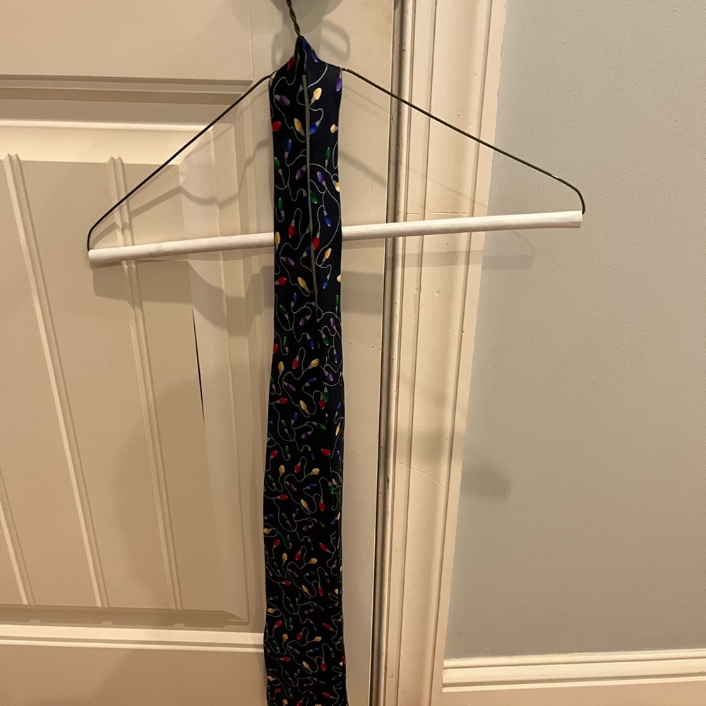 Christmas tie. Navy blue w/ multicolored lights (not actual lights, a pattern)